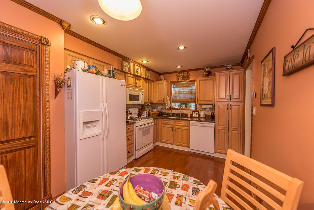 25 North Westfield Road Howell, NJ 07731 - Photo 6 of 25 a kitchen with a refrigerator and white cabinets