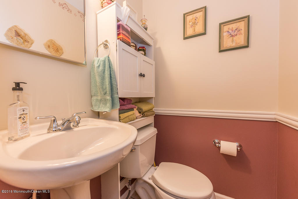 25 North Westfield Road Howell, NJ 07731 - Photo 8 of 25 a bathroom with a sink a toilet and mirror
