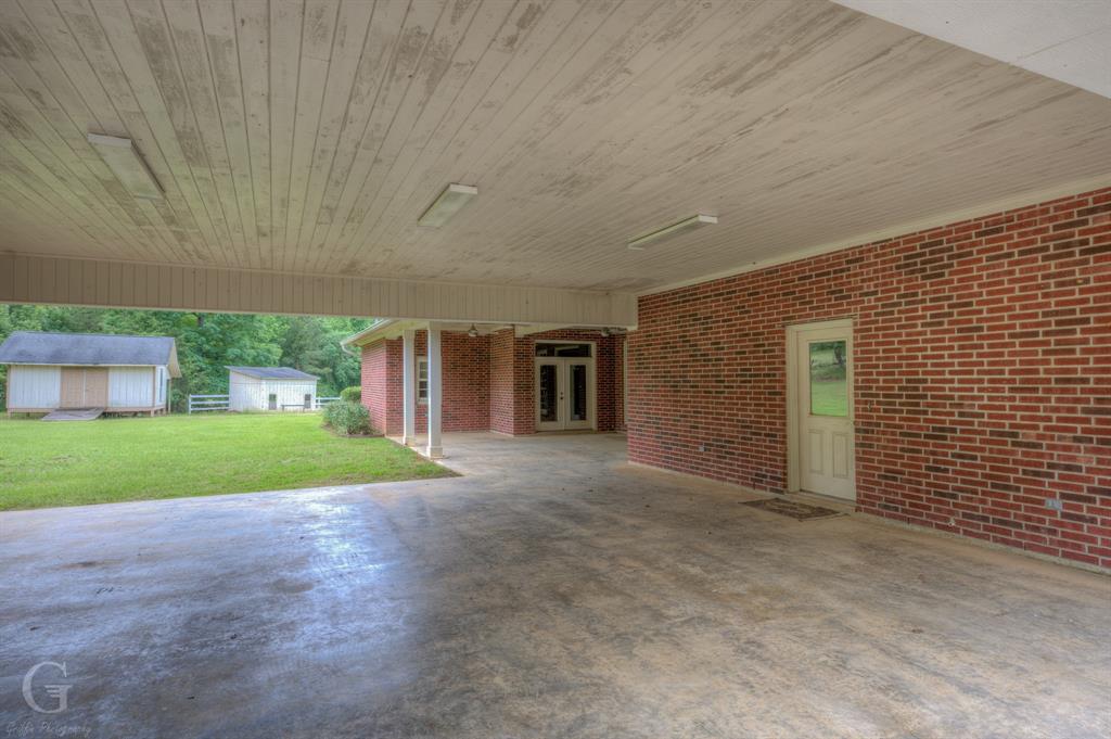1212 WPA Road Homer, LA 71040 - Photo 8 of 35 View of patio / terrace featuring french doors and an outdoor structure
