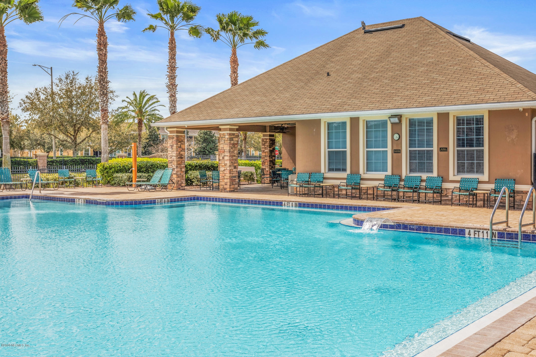 12940 Spring Rain Road Jacksonville, FL 32258 - Photo 17 of 20 a view of a swimming pool with outdoor seating