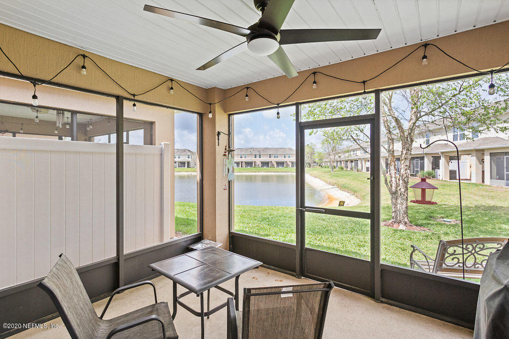 12940 Spring Rain Road Jacksonville, FL 32258 - Photo 6 of 20 a bedroom with furniture and large windows