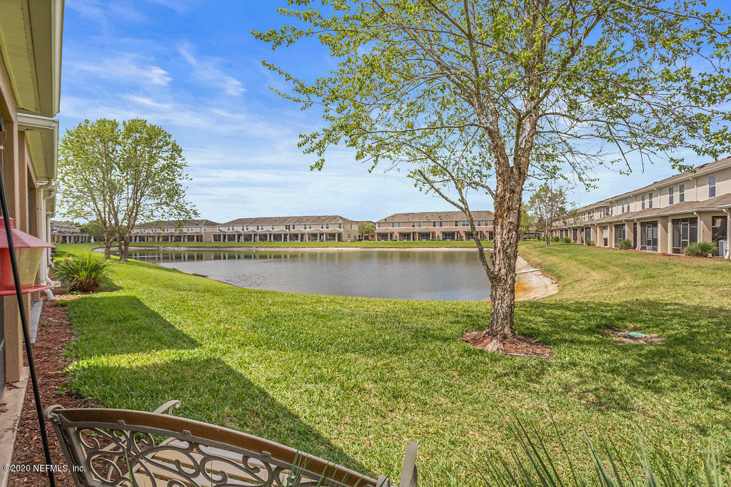 12940 Spring Rain Road Jacksonville, FL 32258 - Photo 7 of 20 a view of a yard with a tree
