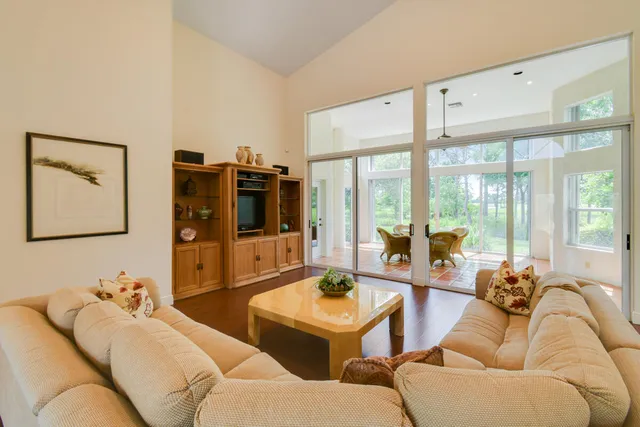 a living room with furniture and a window