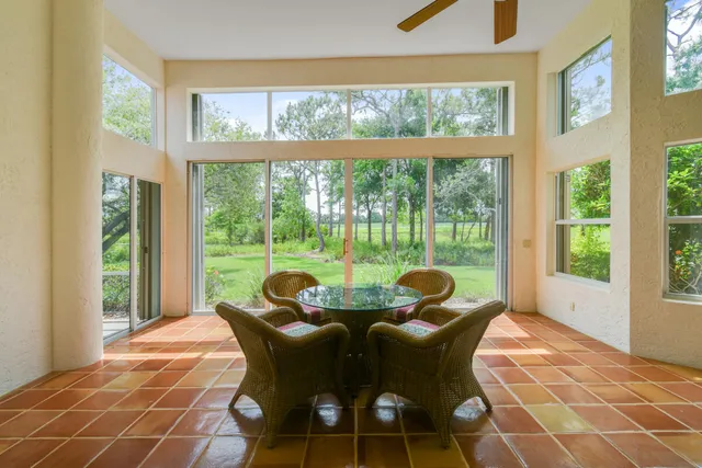 a view of a dining room with furniture window and outside view