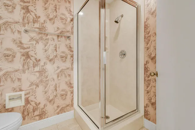 a spacious bathroom with a sink a large mirror and a bathtub next to a window
