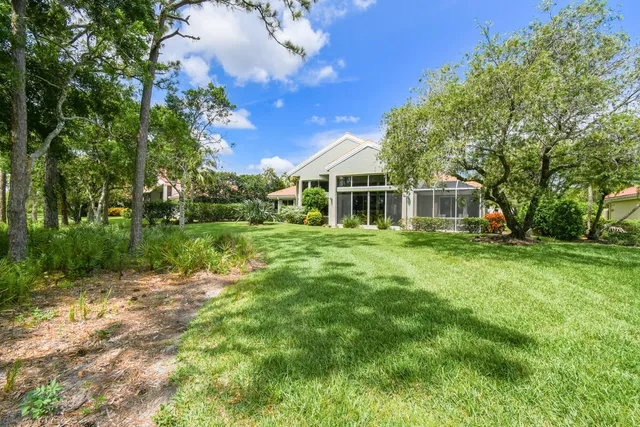 a view of a pool with a yard