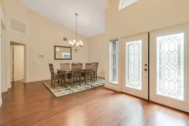 a living room filled with furniture and a floor to ceiling window
