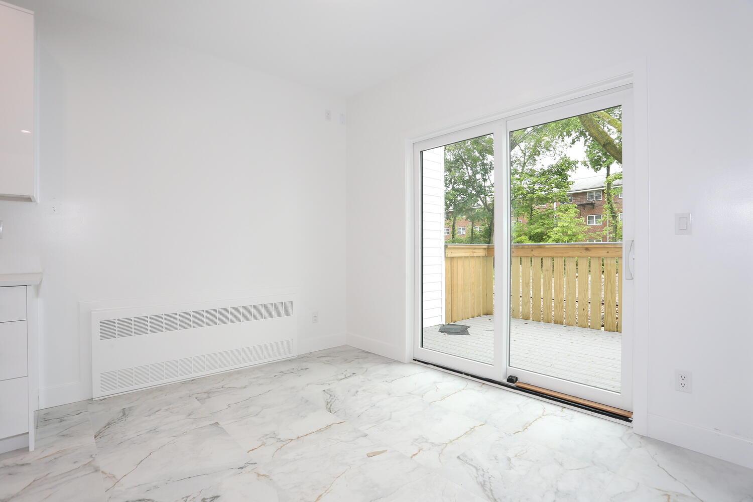 37 Ewing Avenue, Unit 202 Spring Valley, NY 10977 - Photo 14 of 44 an empty room with large windows