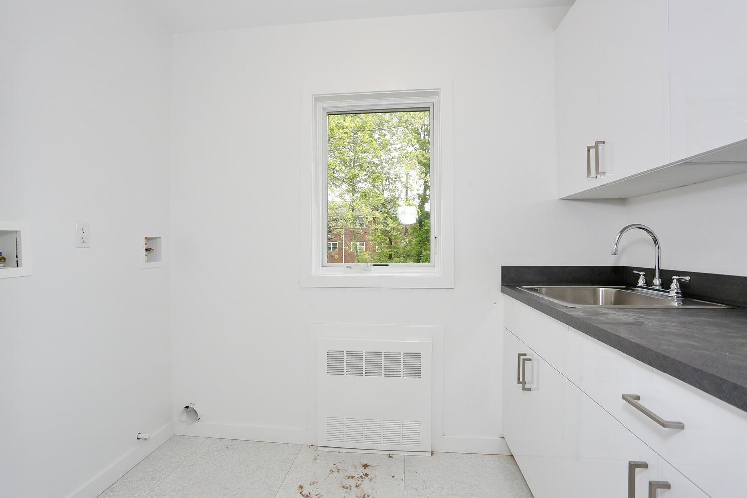 37 Ewing Avenue, Unit 202 Spring Valley, NY 10977 - Photo 30 of 44 a kitchen with a sink and cabinets
