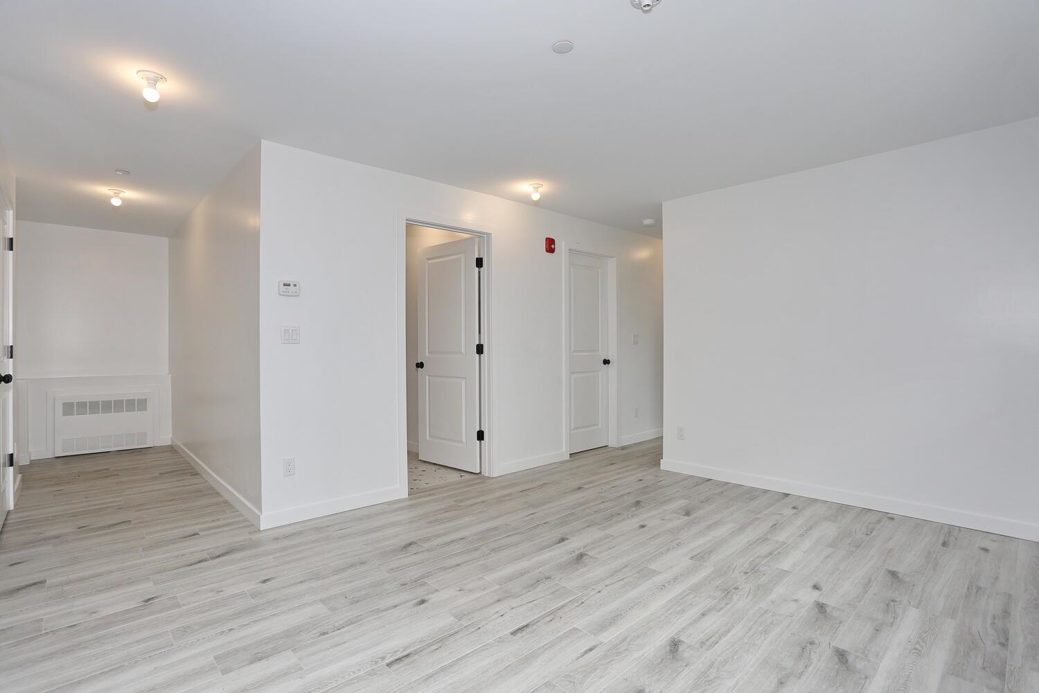 37 Ewing Avenue, Unit 202 Spring Valley, NY 10977 - Photo 32 of 44 wooden floor in an empty room with wooden floor