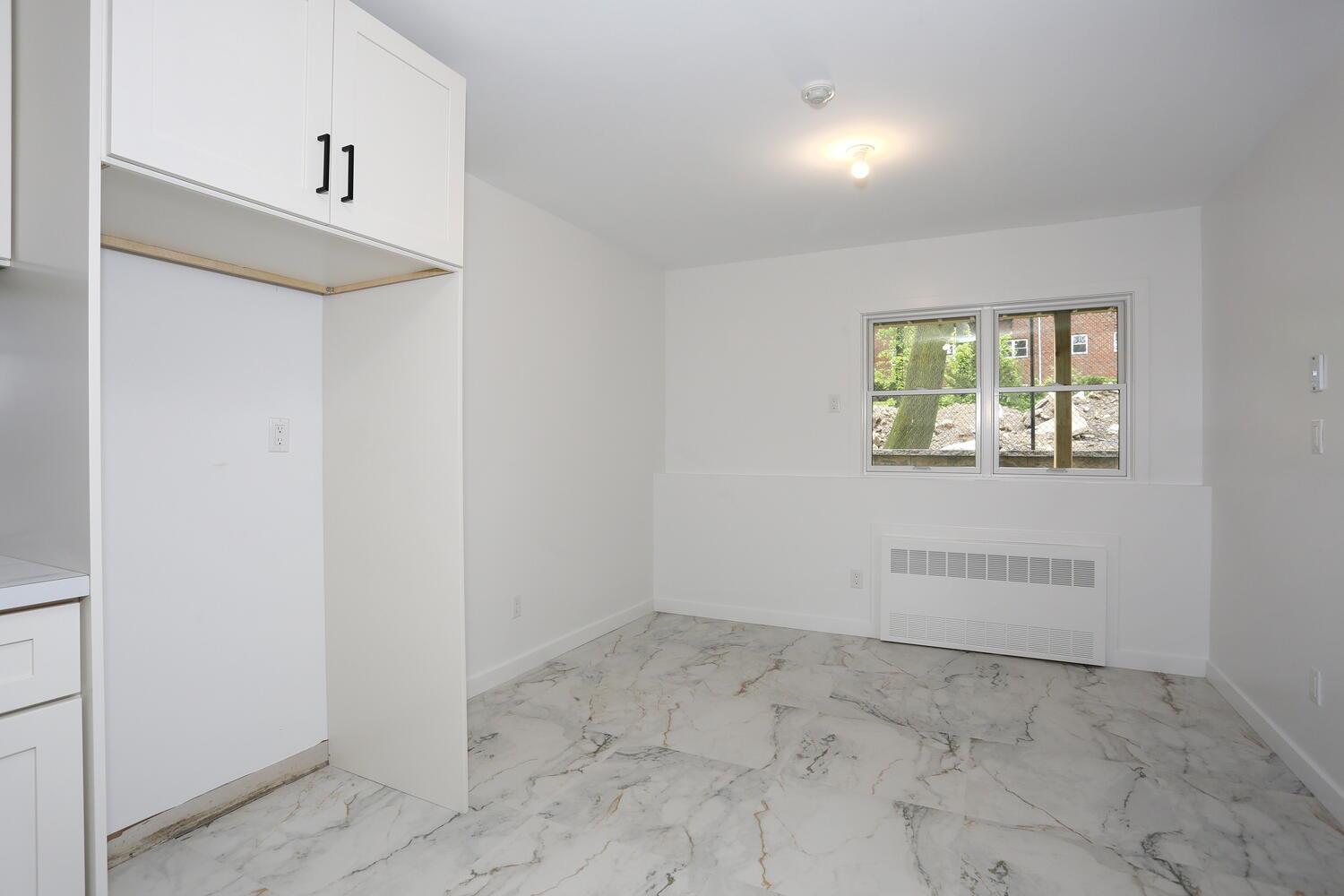 37 Ewing Avenue, Unit 202 Spring Valley, NY 10977 - Photo 36 of 44 an empty room with windows