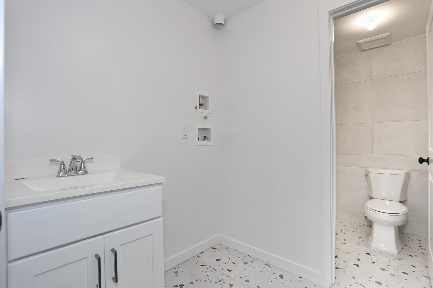 37 Ewing Avenue, Unit 202 Spring Valley, NY 10977 - Photo 42 of 44 a bathroom with a sink a toilet and a shower