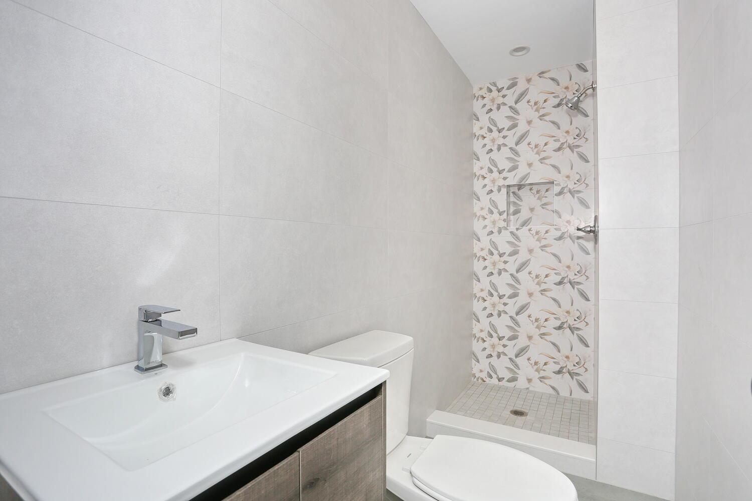 37 Ewing Avenue, Unit 202 Spring Valley, NY 10977 - Photo 44 of 44 a bathroom with a sink toilet and shower