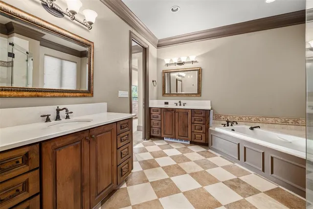 a spacious bathroom with a double vanity sink mirror and double