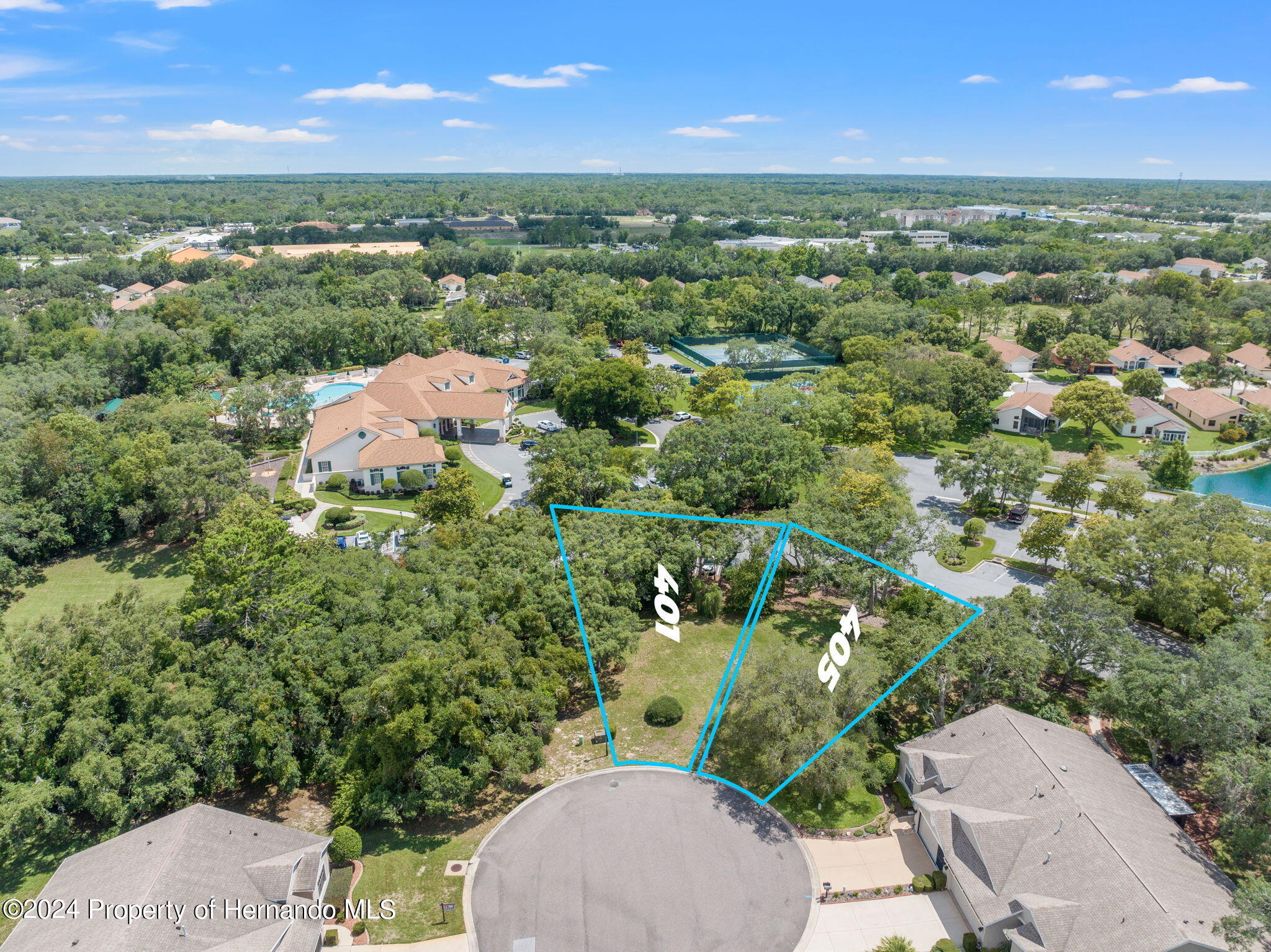 401-405 Candlestone Court Spring Hill, FL 34609 - Photo 2 of 11 an aerial view of a houses with a yard