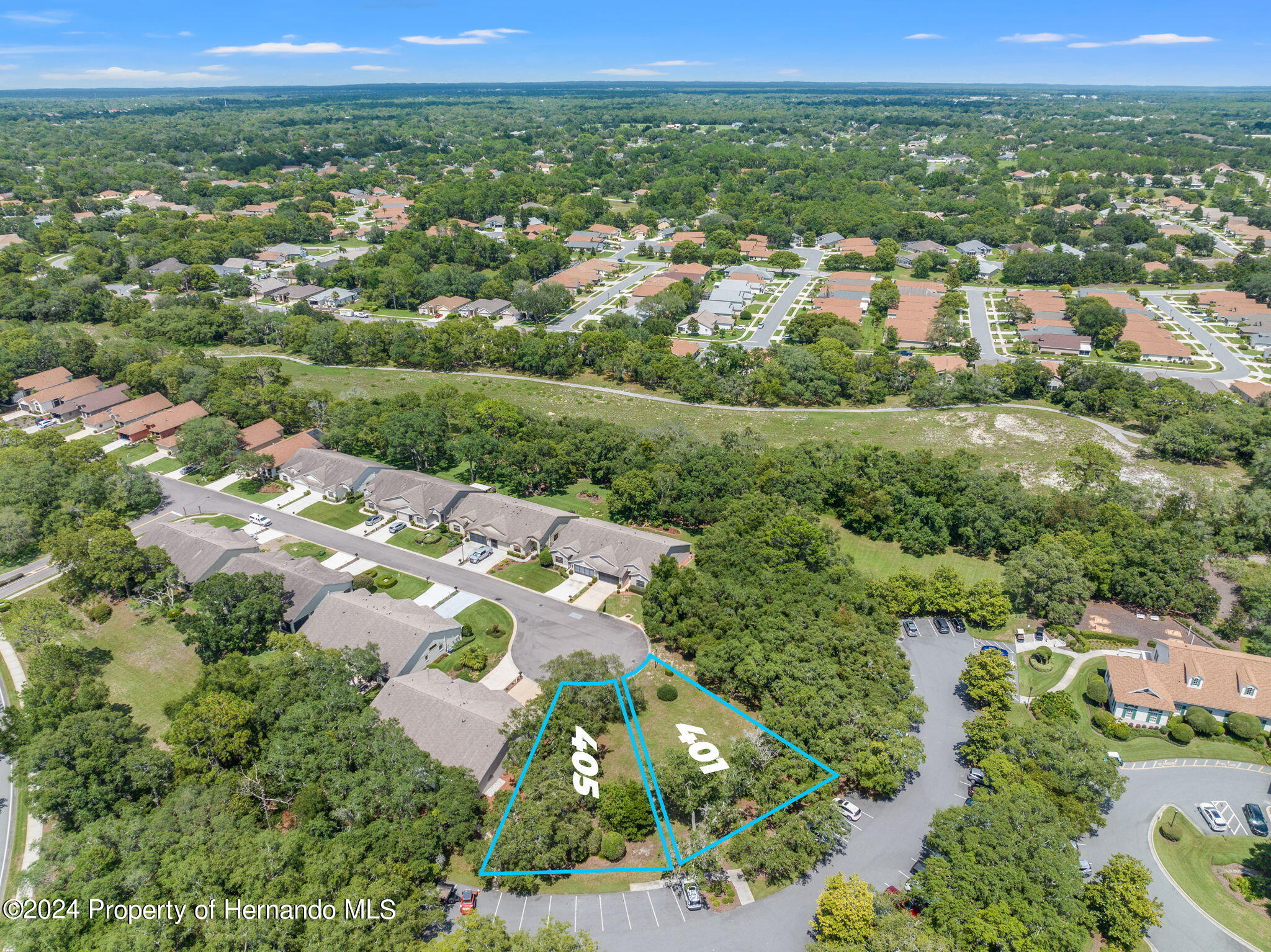 401-405 Candlestone Court Spring Hill, FL 34609 - Photo 3 of 11 an aerial view of multiple house