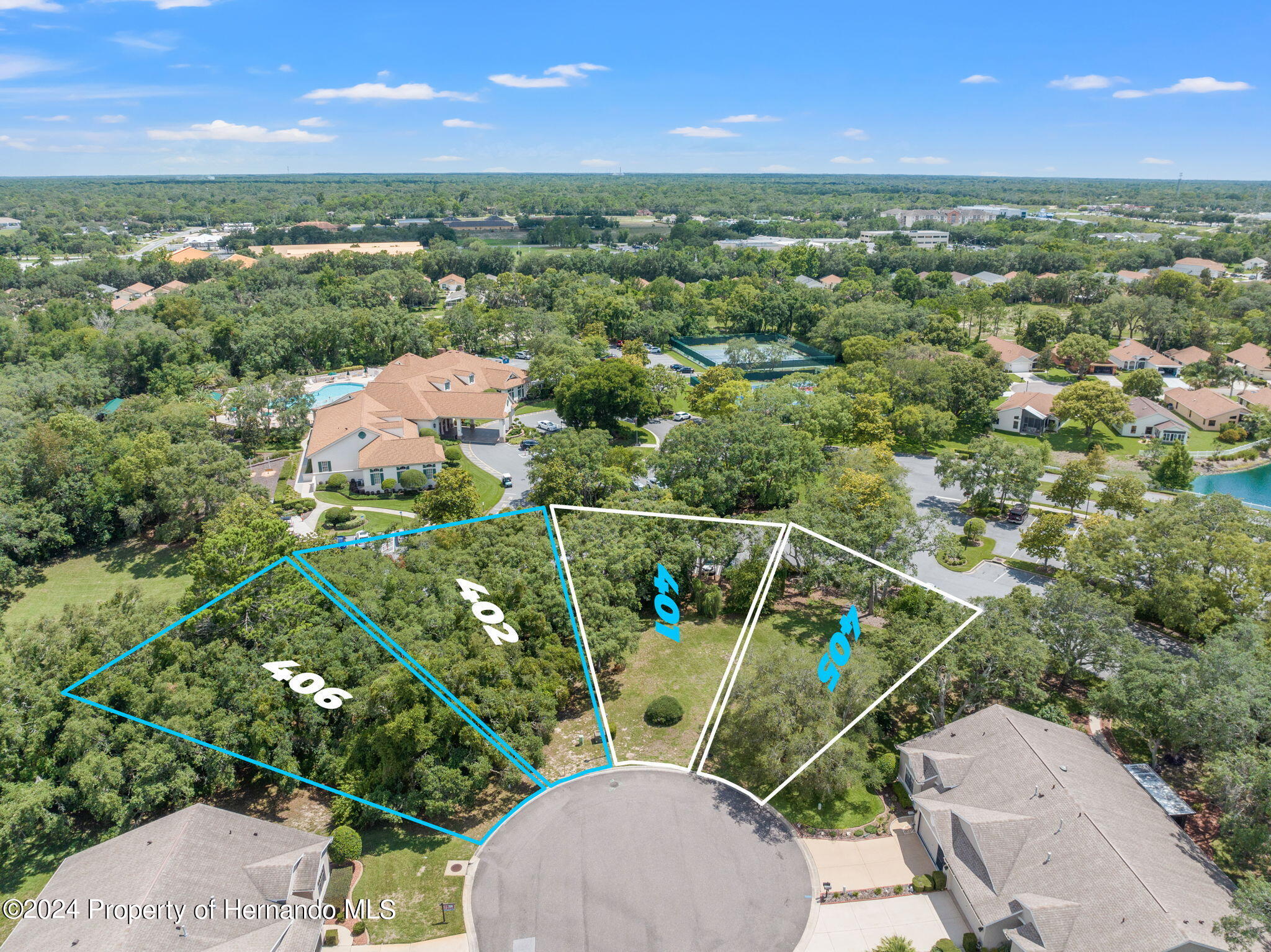 401-405 Candlestone Court Spring Hill, FL 34609 - Photo 4 of 11 an aerial view of a houses with a yard