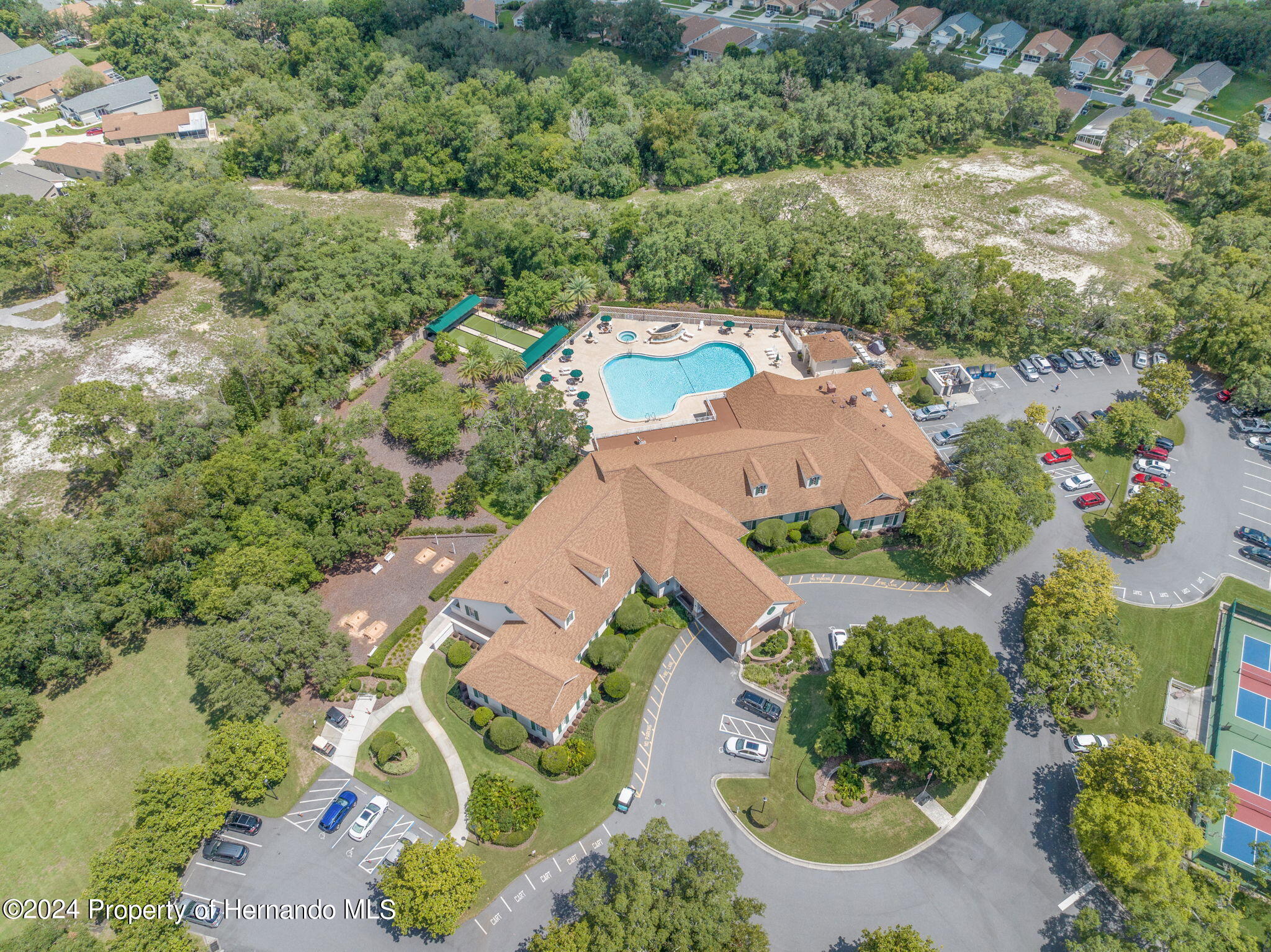 401-405 Candlestone Court Spring Hill, FL 34609 - Photo 5 of 11 an aerial view of a house with a yard