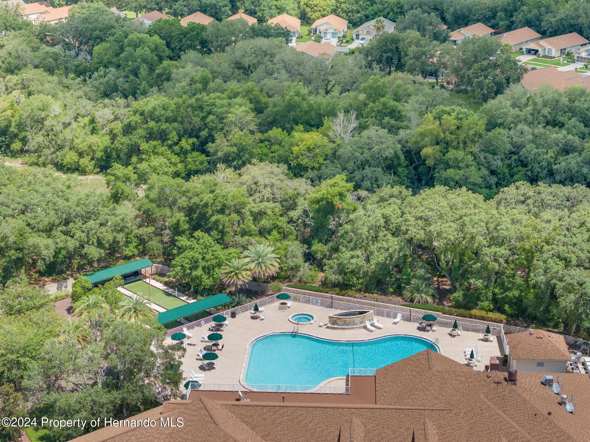 401-405 Candlestone Court Spring Hill, FL 34609 - Photo 6 of 11 an aerial view of a house with yard swimming pool and lake view