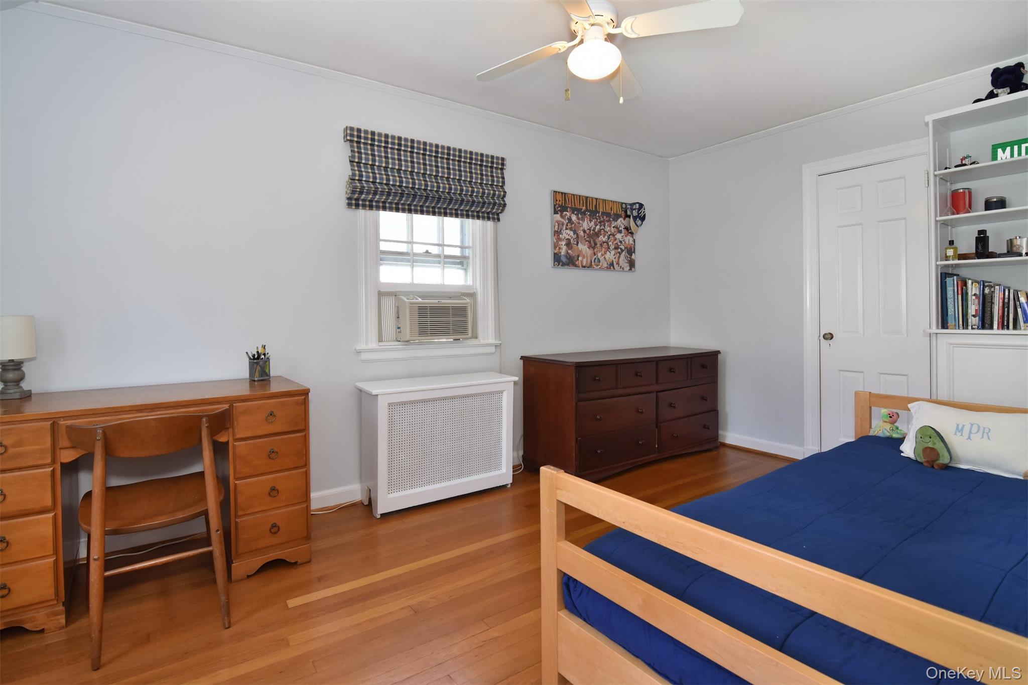 147 Midland Avenue Bronxville, NY 10708 - Photo 14 of 25 a bedroom with a bed and a dresser