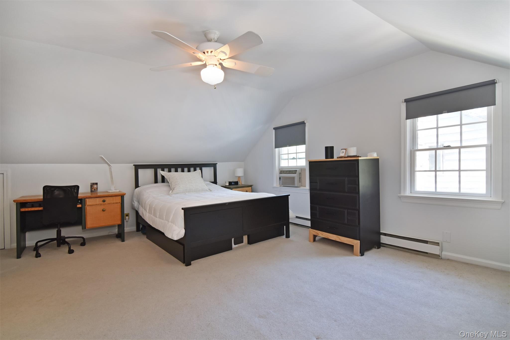 147 Midland Avenue Bronxville, NY 10708 - Photo 17 of 25 a bedroom with bed and window