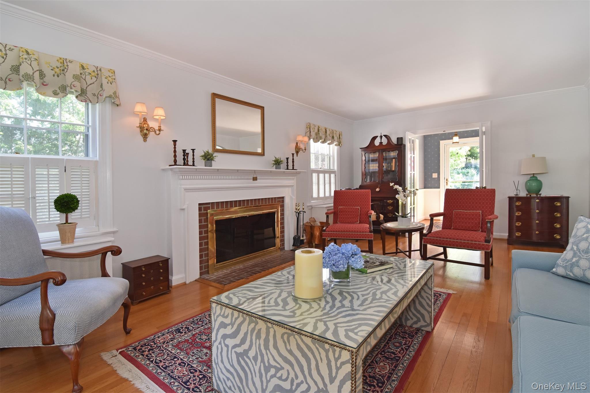 147 Midland Avenue Bronxville, NY 10708 - Photo 2 of 25 a living room with furniture and a fireplace