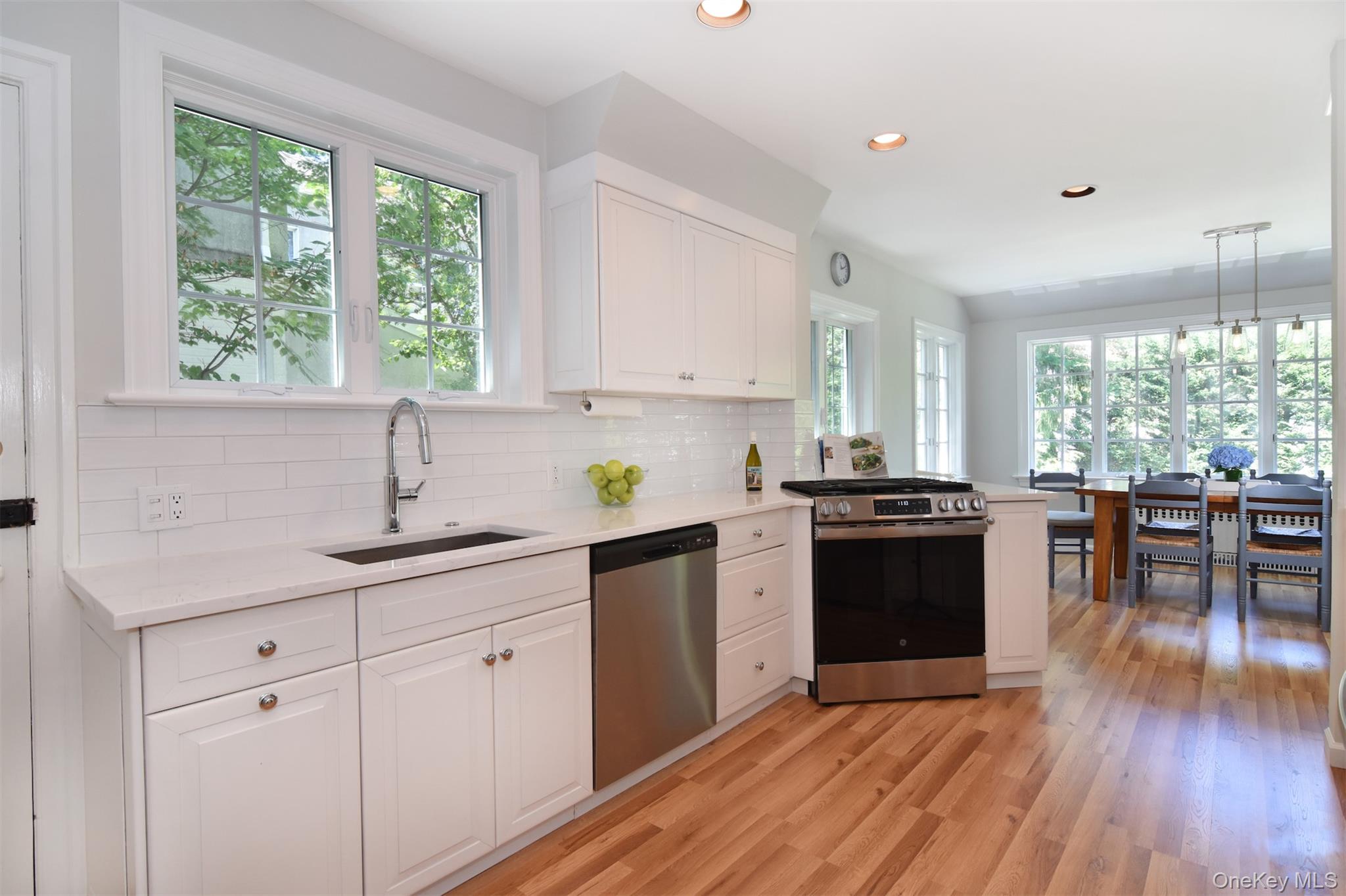 147 Midland Avenue Bronxville, NY 10708 - Photo 7 of 25 a kitchen with a sink a stove and cabinets