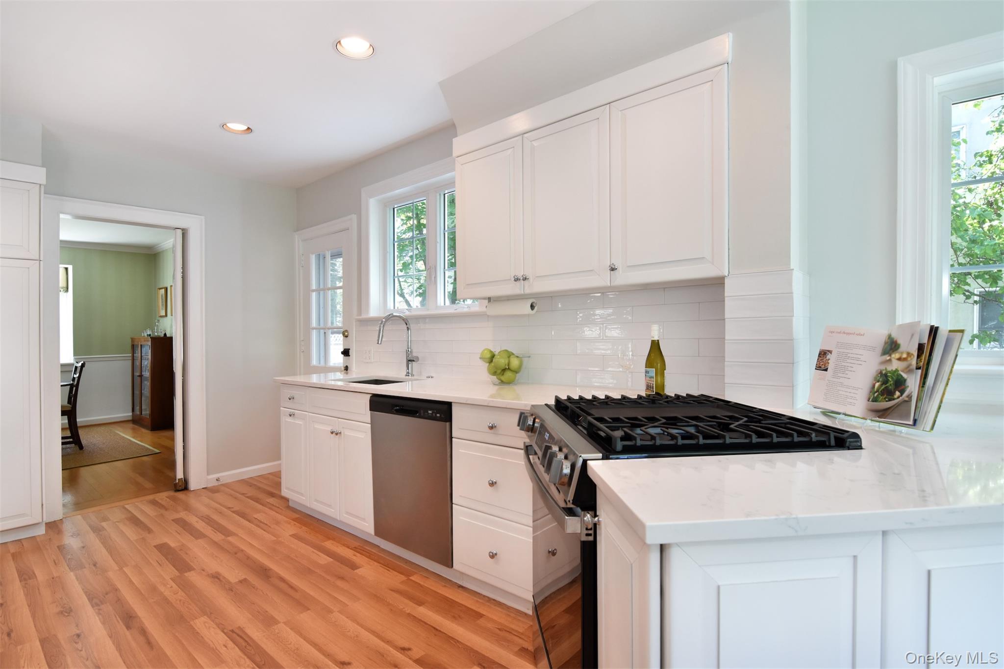 147 Midland Avenue Bronxville, NY 10708 - Photo 8 of 25 a kitchen with stainless steel appliances granite countertop a sink stove and cabinets