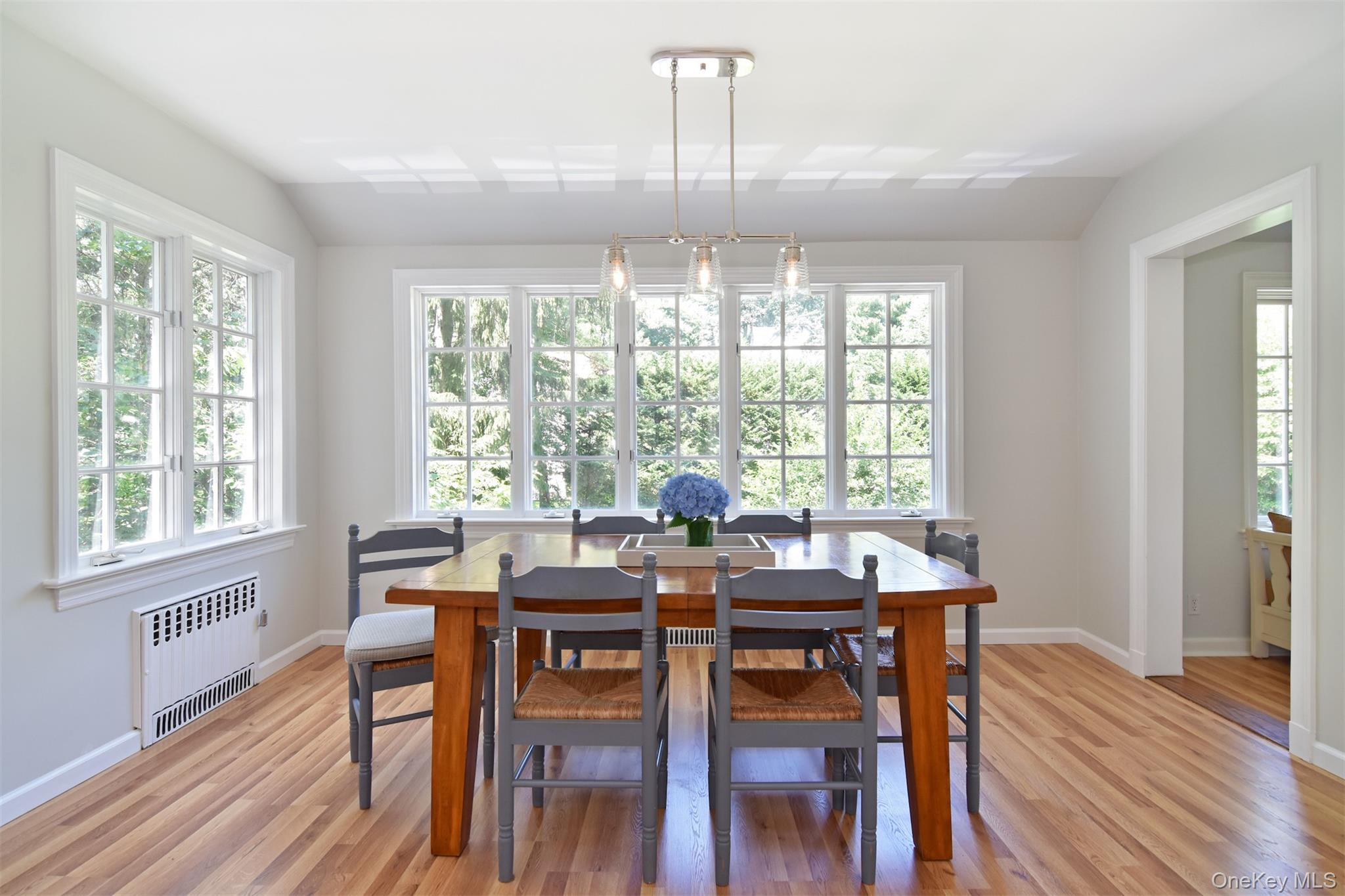 147 Midland Avenue Bronxville, NY 10708 - Photo 9 of 25 a view of a dining room with furniture windows and wooden floor