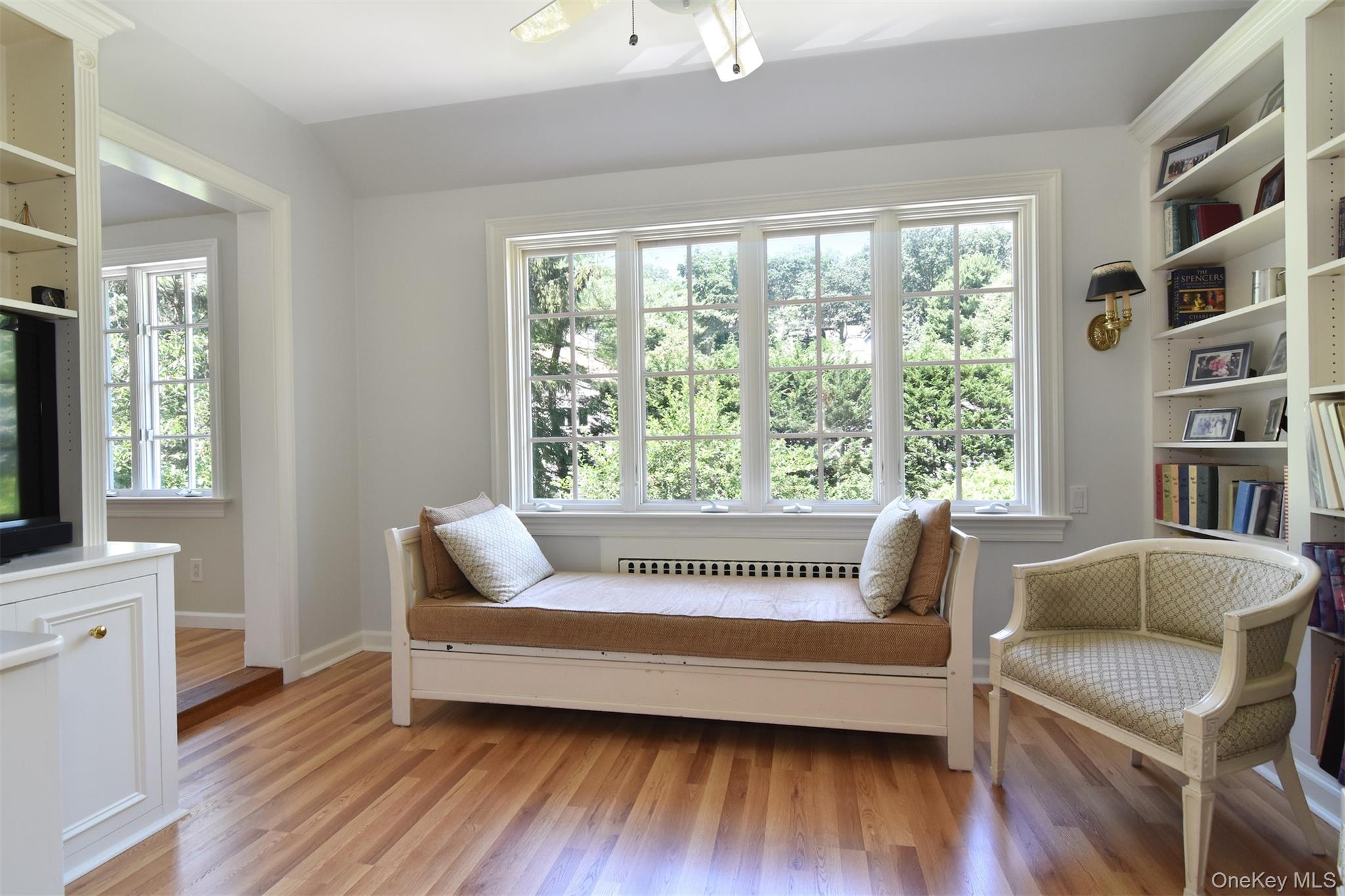 147 Midland Avenue Bronxville, NY 10708 - Photo 10 of 25 a living room with a couch and a large window