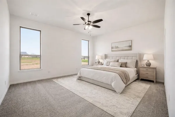 a view of a livingroom with a ceiling fan and a ceiling fan