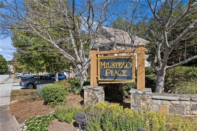 a street sign on a pole on a sidewalk