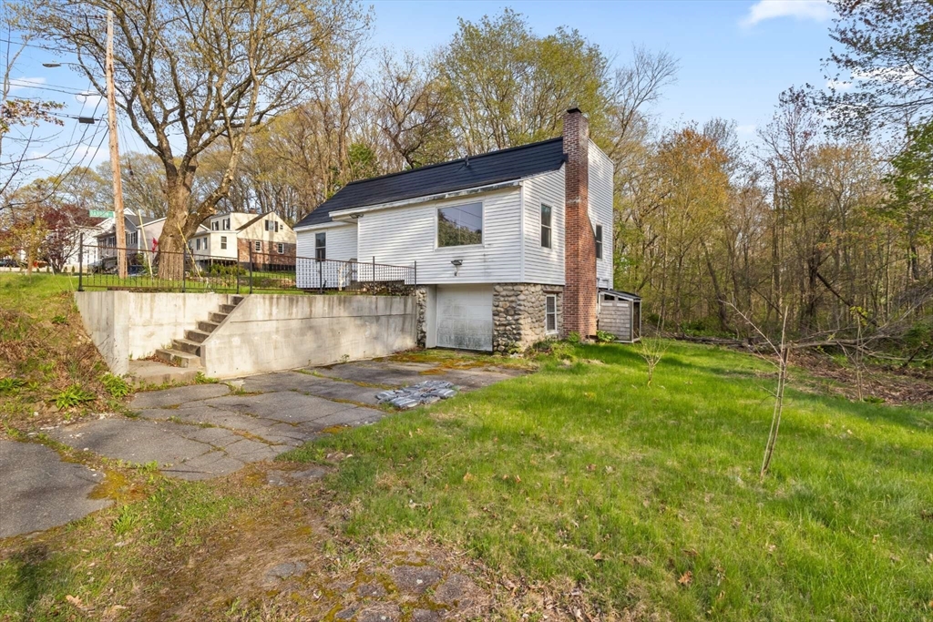7 Darrow Street Worcester, MA 01606 - Photo 4 of 42 a front view of a house with a yard and lake view