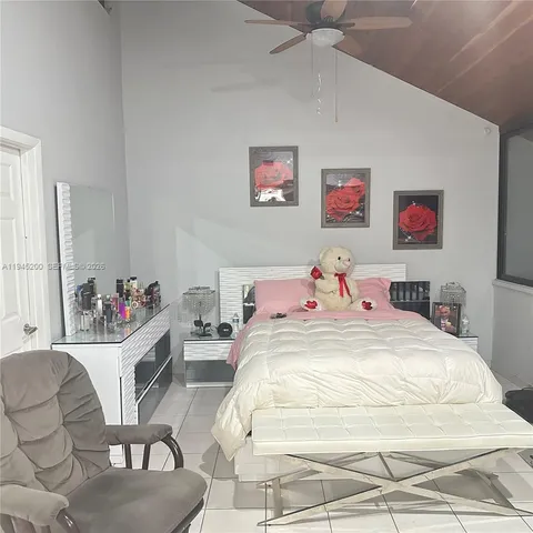 a bed room with a bed a couch and a couch