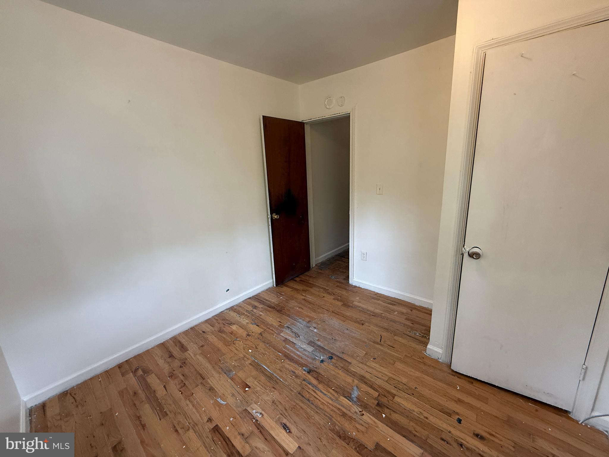 1016 Potter Street Chester, PA 19013 - Photo 13 of 22 a view of an empty room with wooden floor and closet