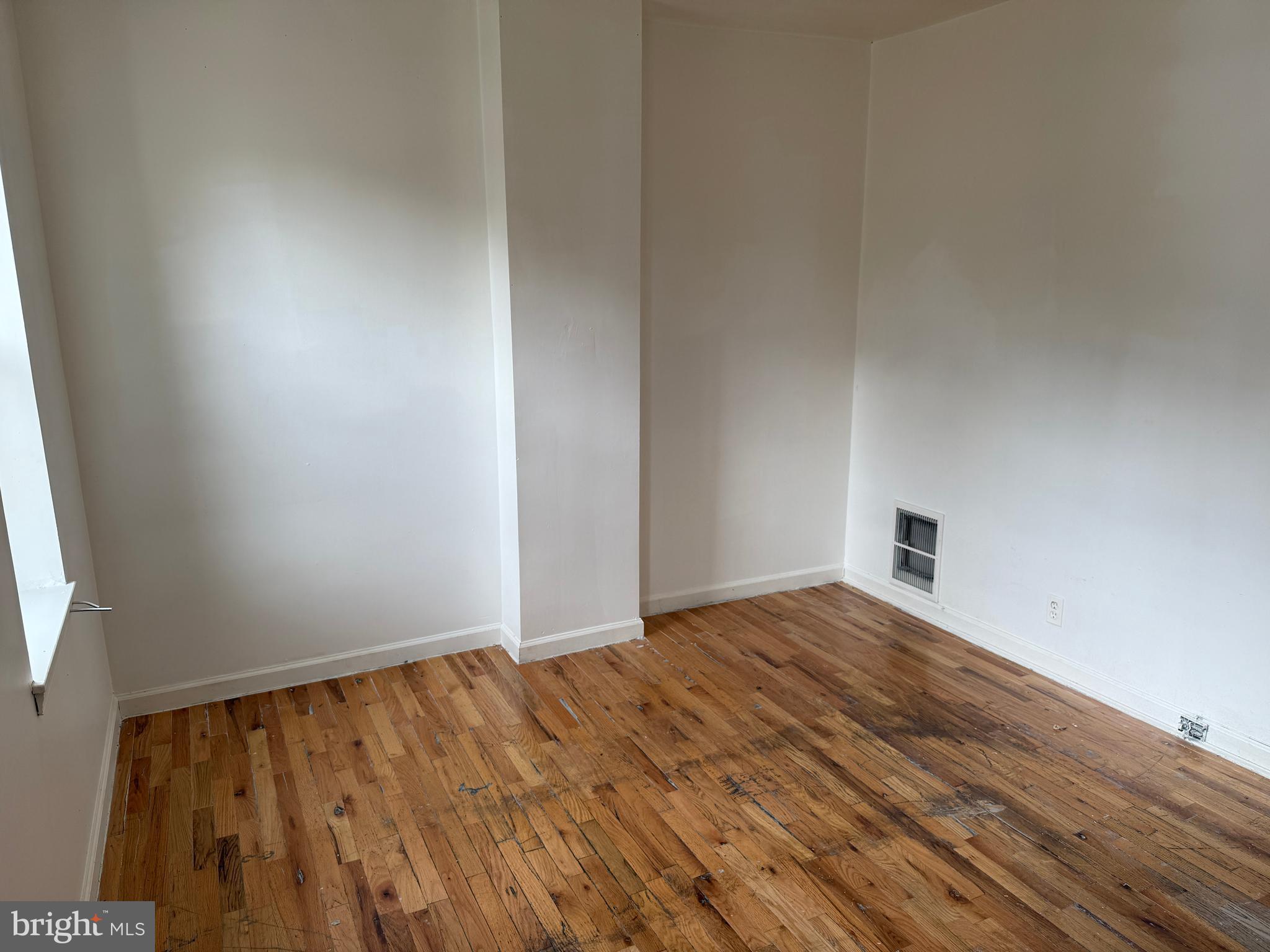 1016 Potter Street Chester, PA 19013 - Photo 20 of 22 a view of an empty room and wooden floor