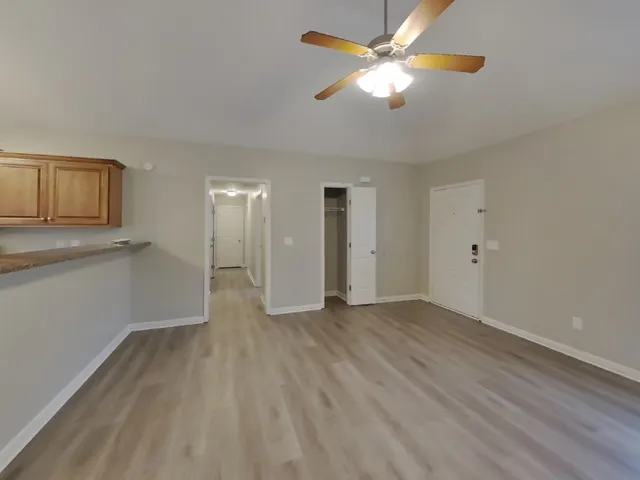 wooden floor in an empty room with a window