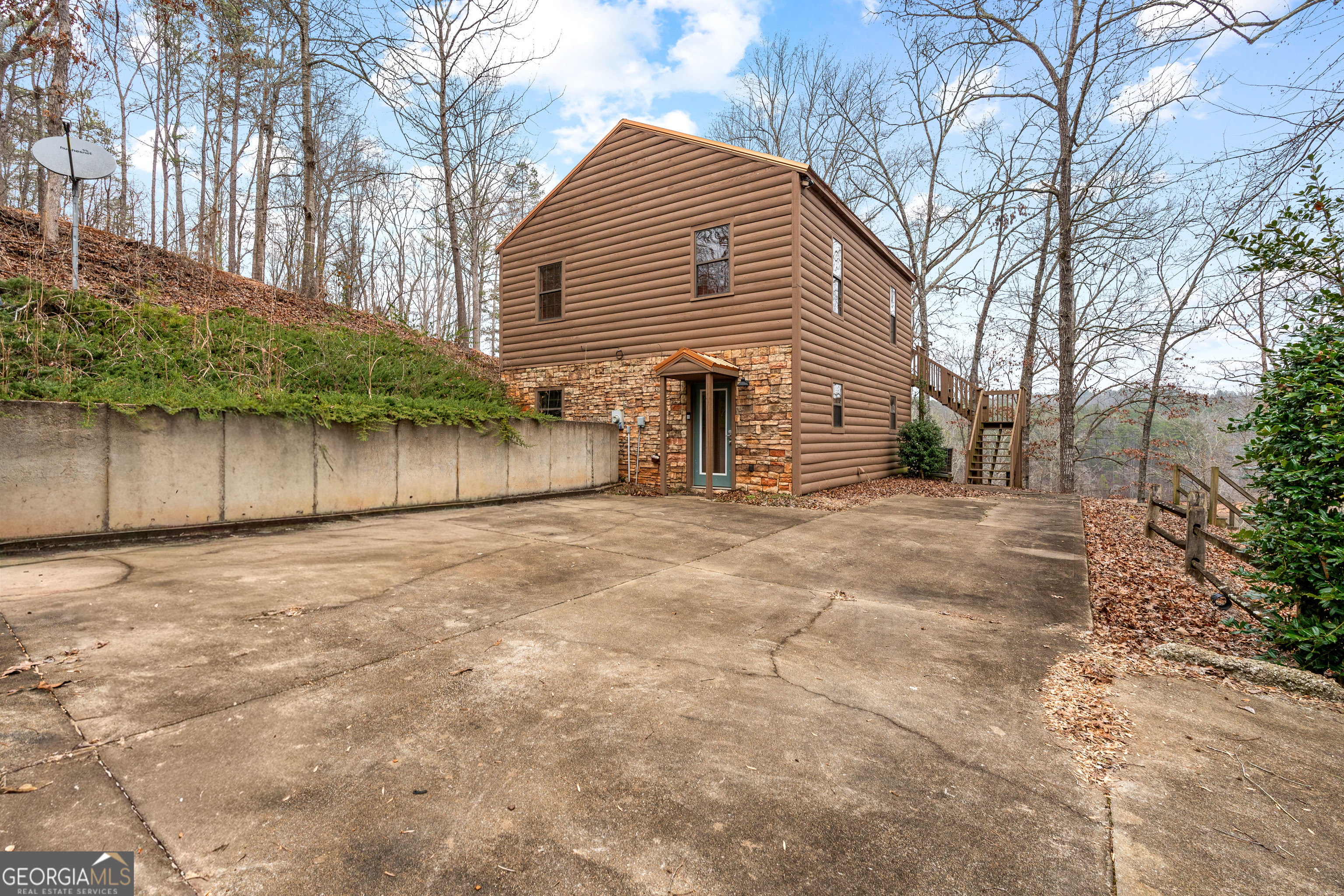 a view of a house with a yard and tree s