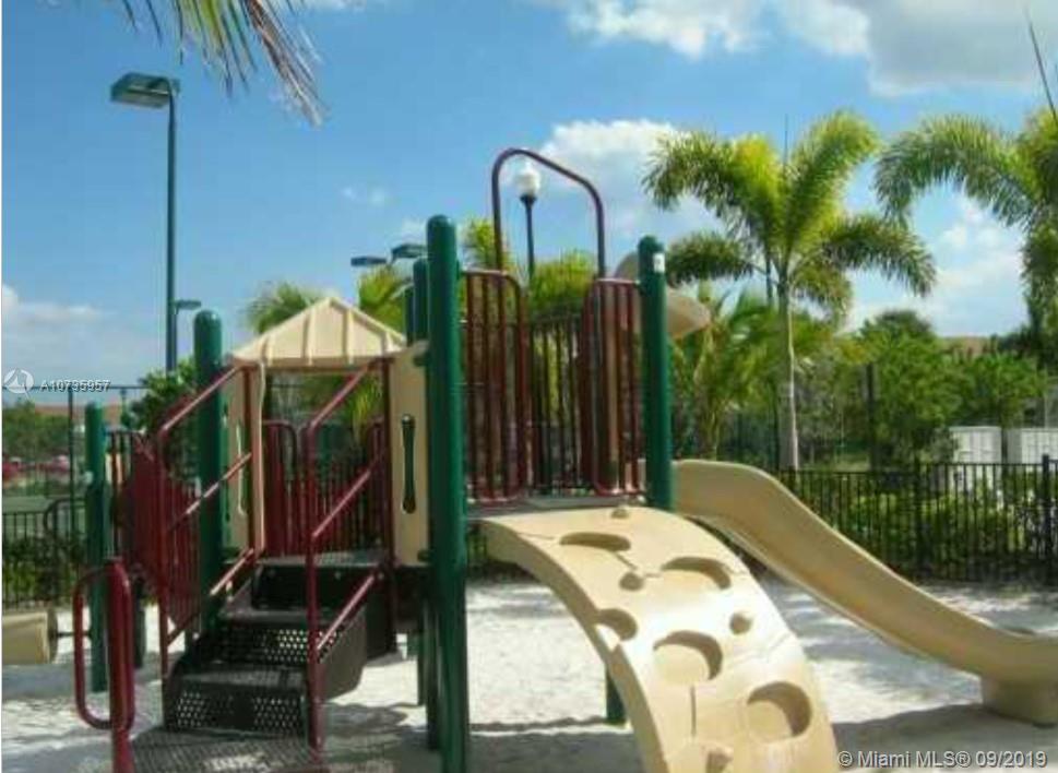 3271 Laurel Ridge Circle, Unit 3271 Riviera Beach, FL 33404 - Photo 4 of 6 play ground in front of the unit