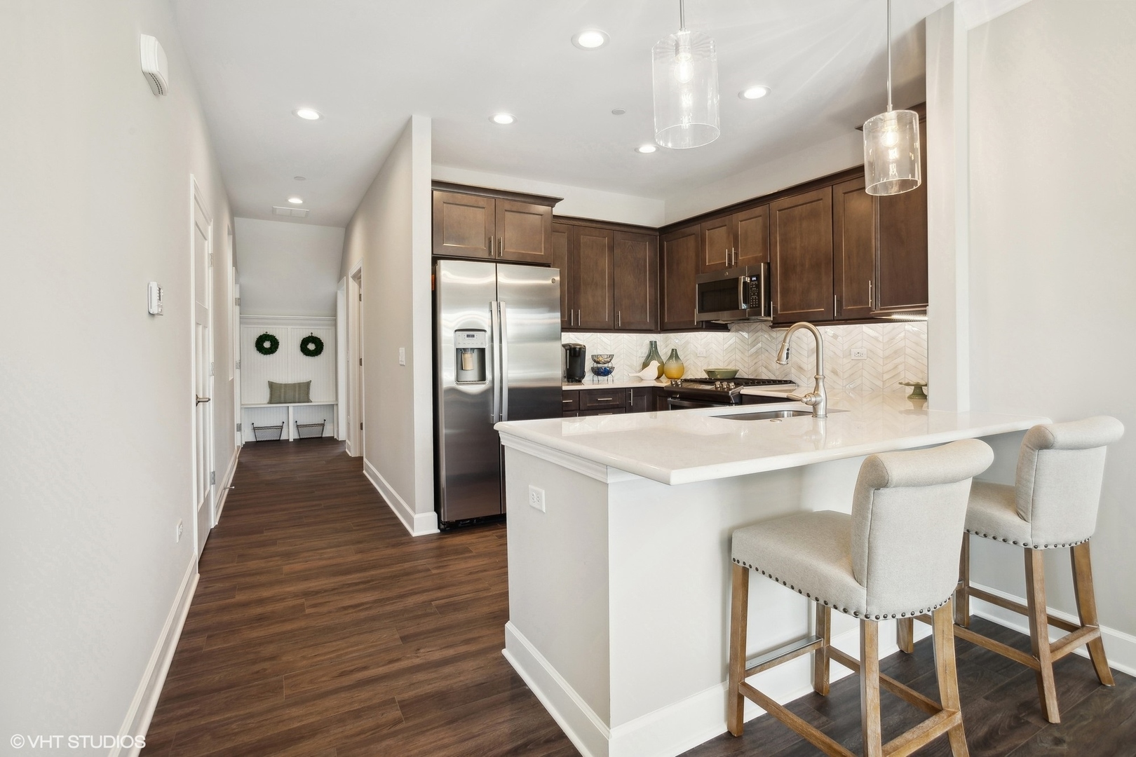 259 Masters Drive Addison, IL 60101 - Photo 5 of 17 a kitchen with stainless steel appliances kitchen island granite countertop a refrigerator and a stove top oven