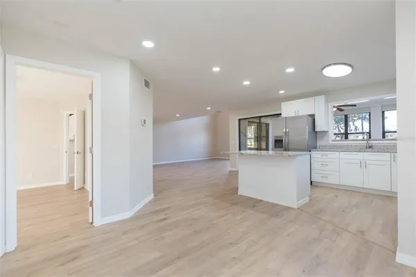 a view of storage and utility room with a window