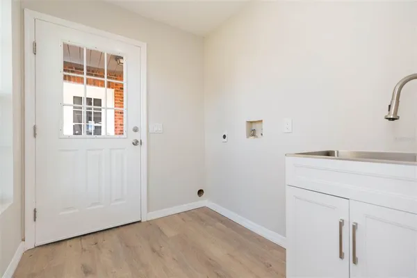 an empty room with fan and windows