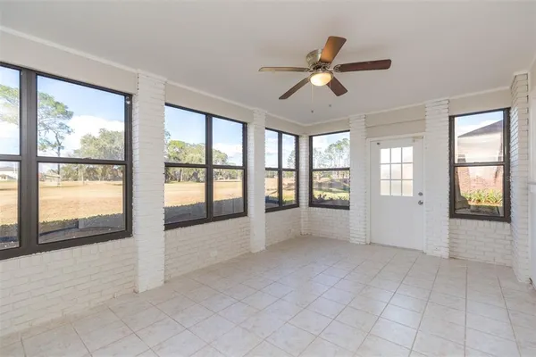 a view of an empty room and window