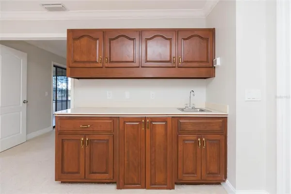 an empty room with closet and windows
