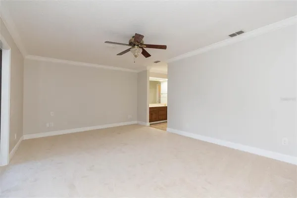 a spacious bathroom with a double vanity sink a large mirror and a shower