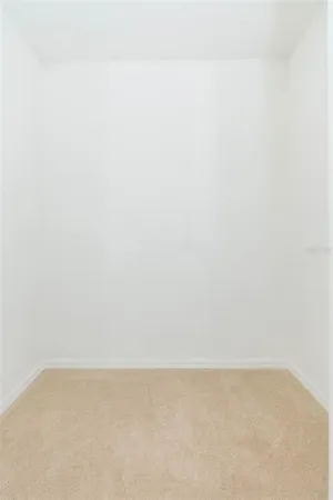 a white toilet sitting next to a bath tub