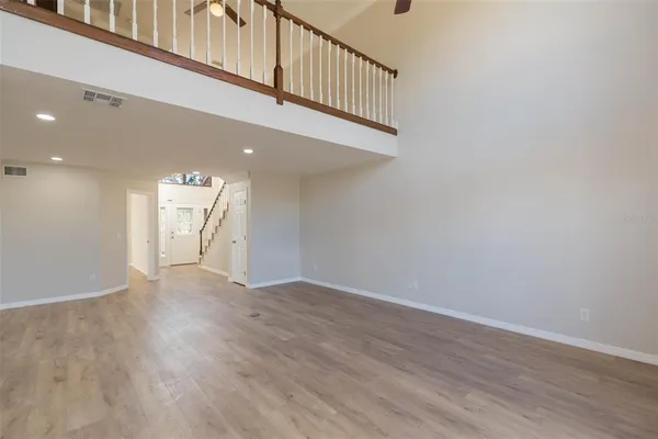 a view of an entryway with wooden floor