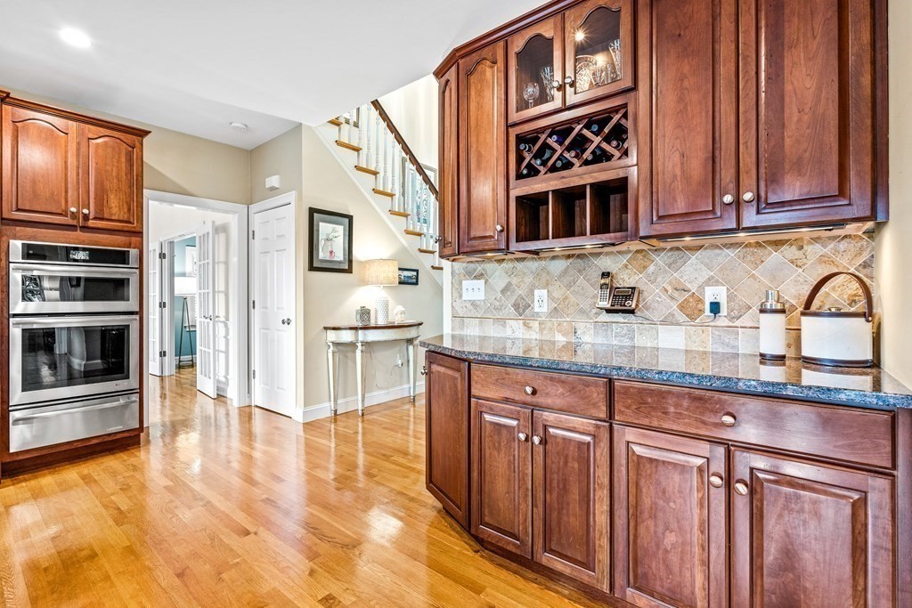 17 Crown Ridge Road Wellesley, MA 02482 - Photo 11 of 37 a kitchen with stainless steel appliances granite countertop a stove and cabinets