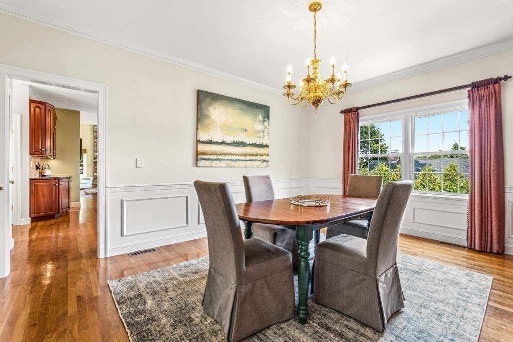 17 Crown Ridge Road Wellesley, MA 02482 - Photo 12 of 37 a view of a dining room with furniture window and wooden floor