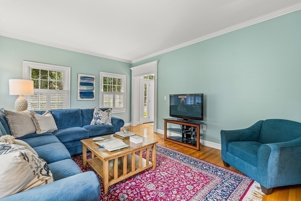 17 Crown Ridge Road Wellesley, MA 02482 - Photo 15 of 37 a living room with furniture and a flat screen tv